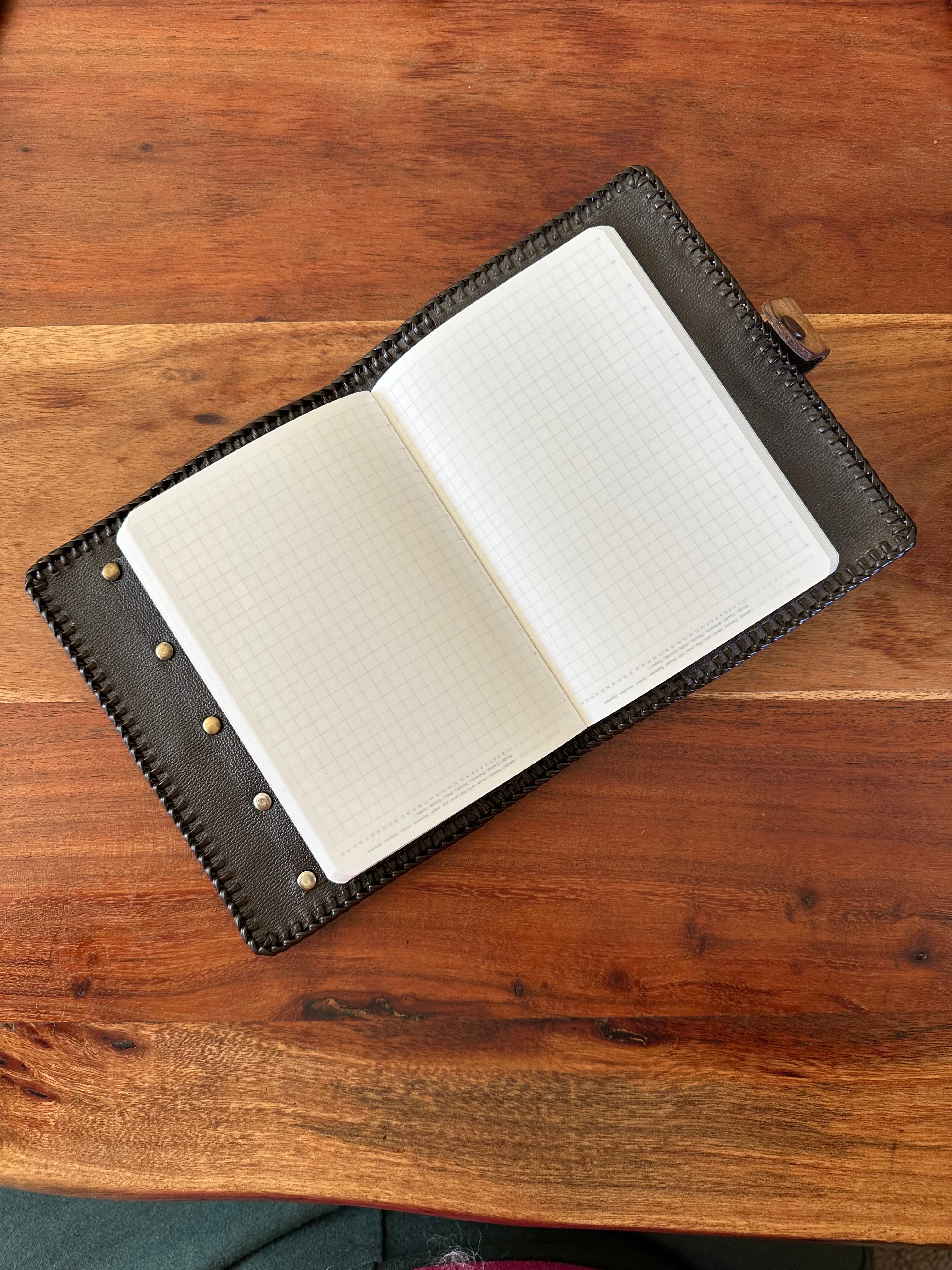 Hand tooled leather notebook cover