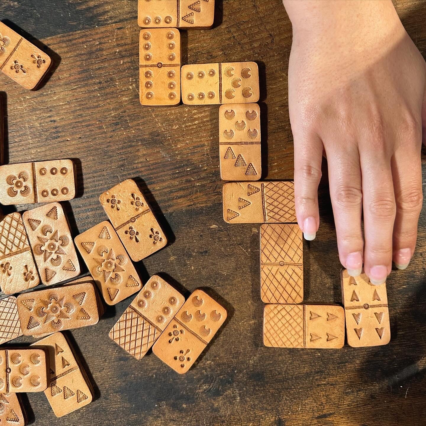 Hand tooled leather dominos