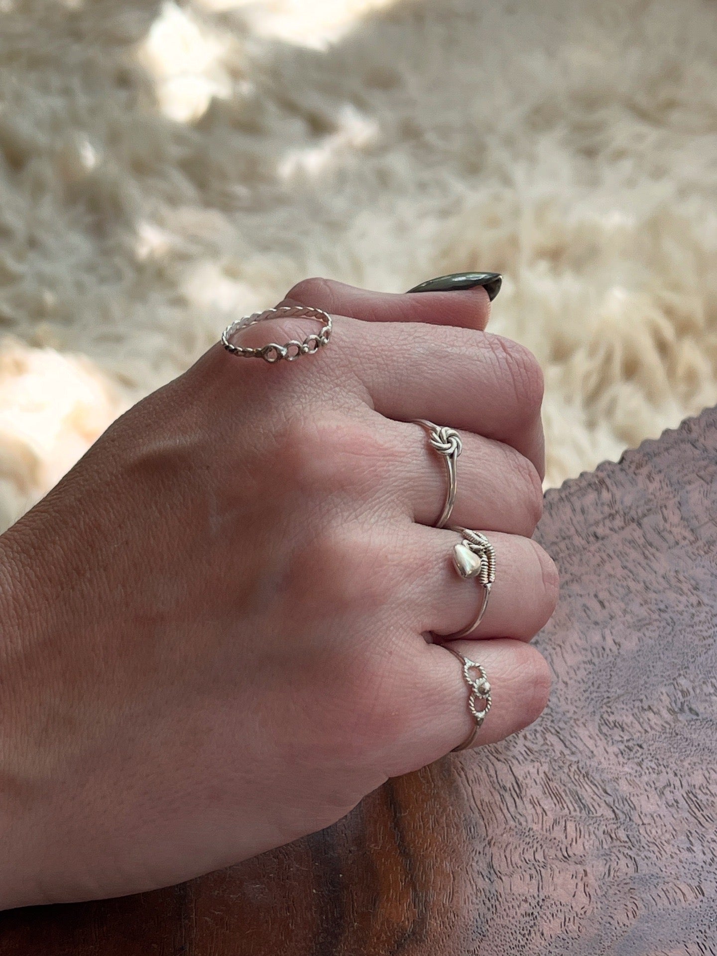 Delicate sterling silver ring with hanging heart