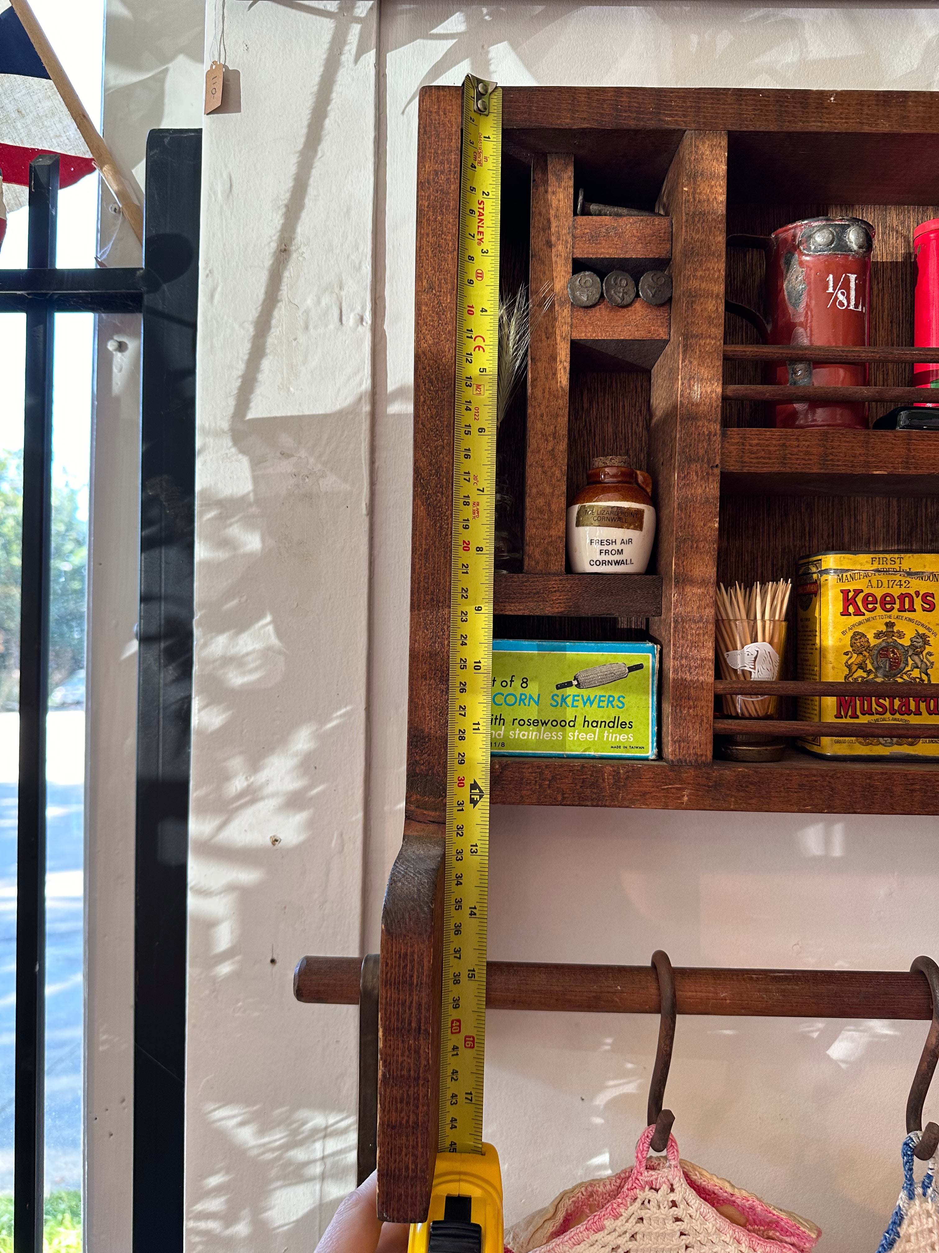 Handmade wooden shelf with hanging rail